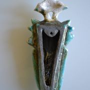 Surreal ceramic sculpture in relief signed to be identified.
