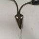 Older wall lamp with black metal shades and brass bend ‘arms’