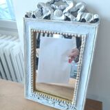 Mirror with ornament