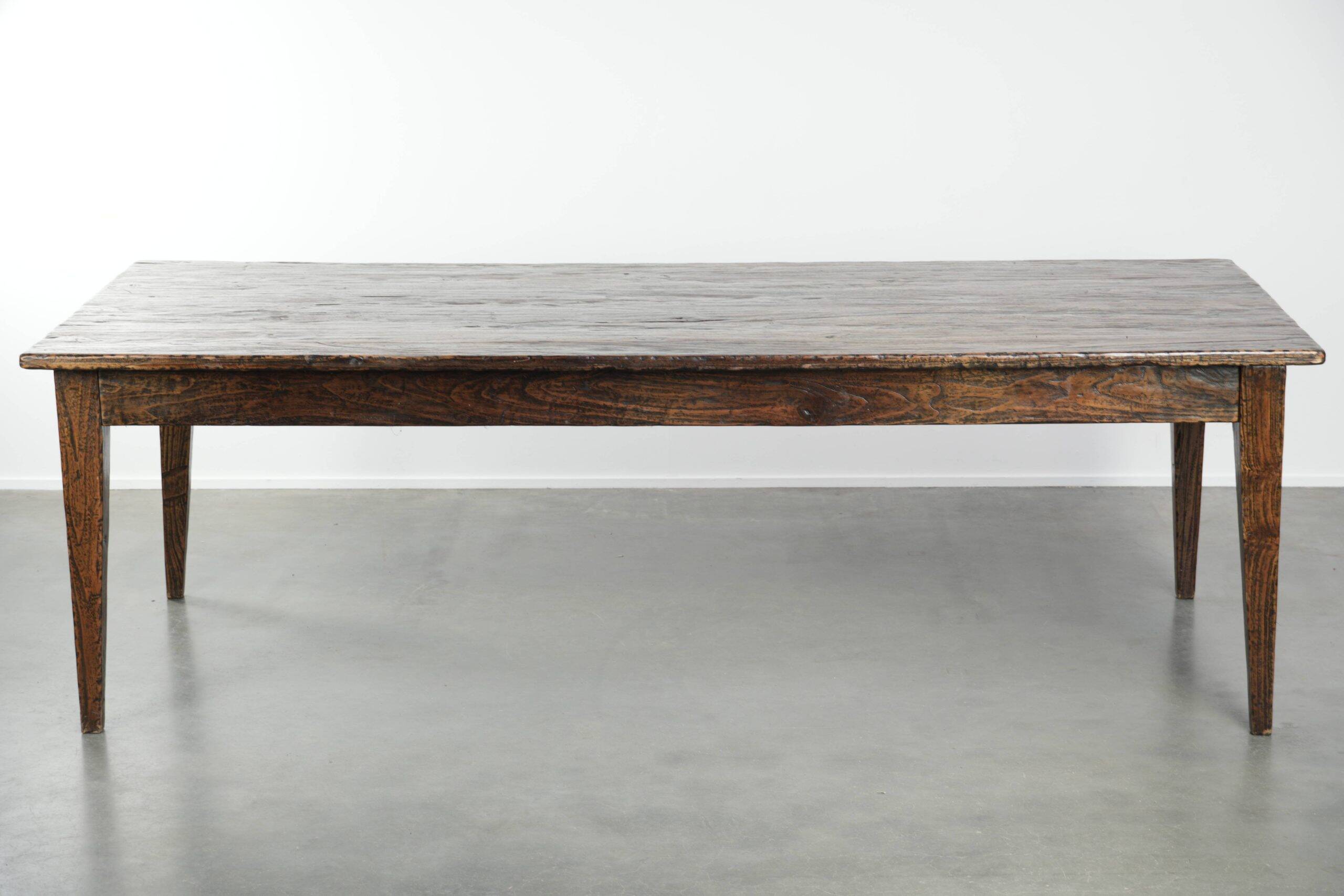 Large rustic dining table made of atmospheric elm wood with fine details