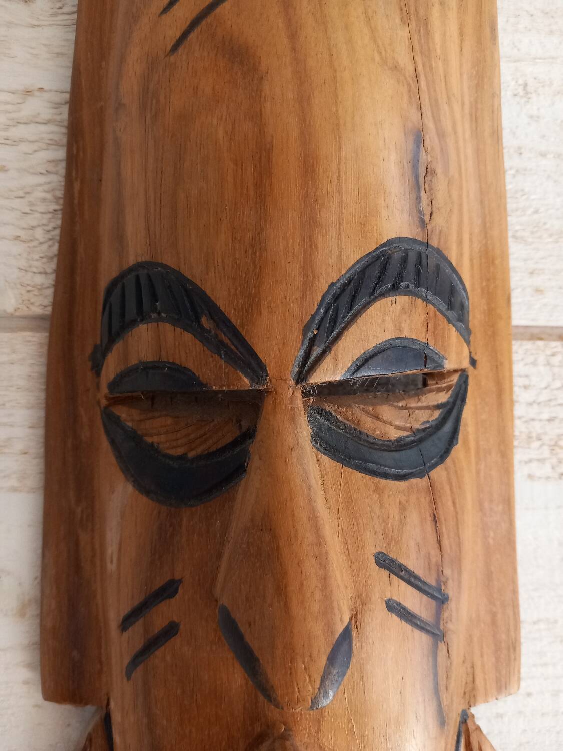 African mask in light wood