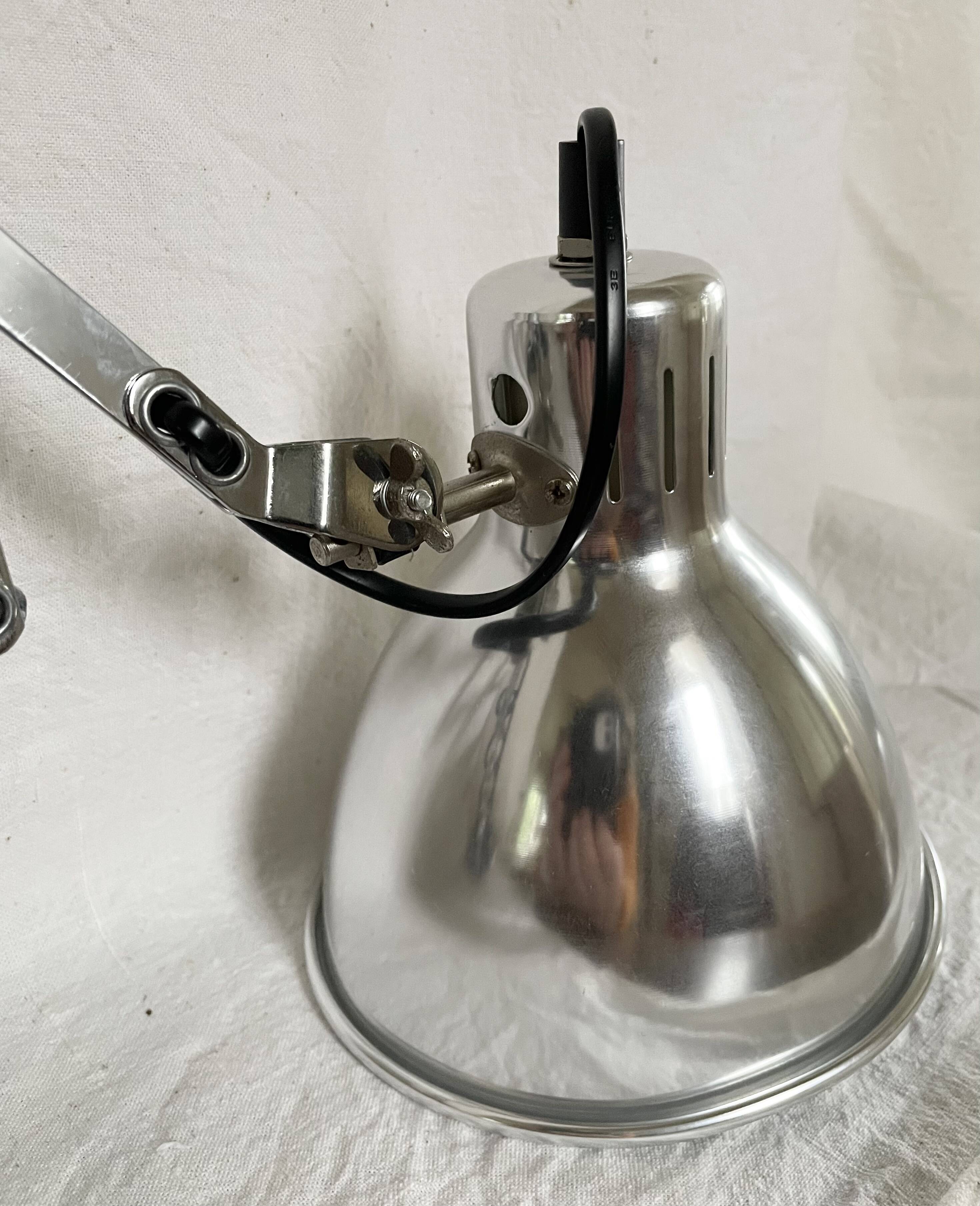 Vintage accordion wall light in chrome metal.