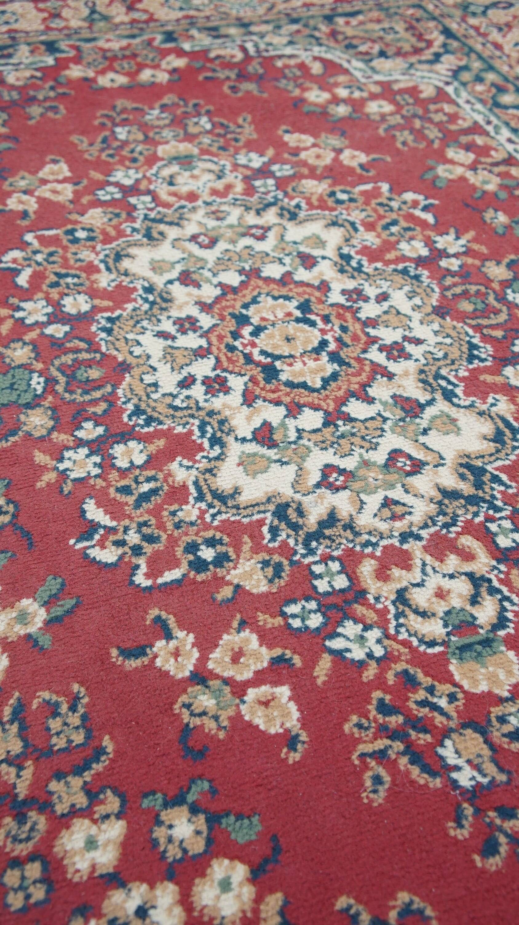 Vintage oriental rug with predominantly red, cream, and beige colors, measuring 168x120 cm