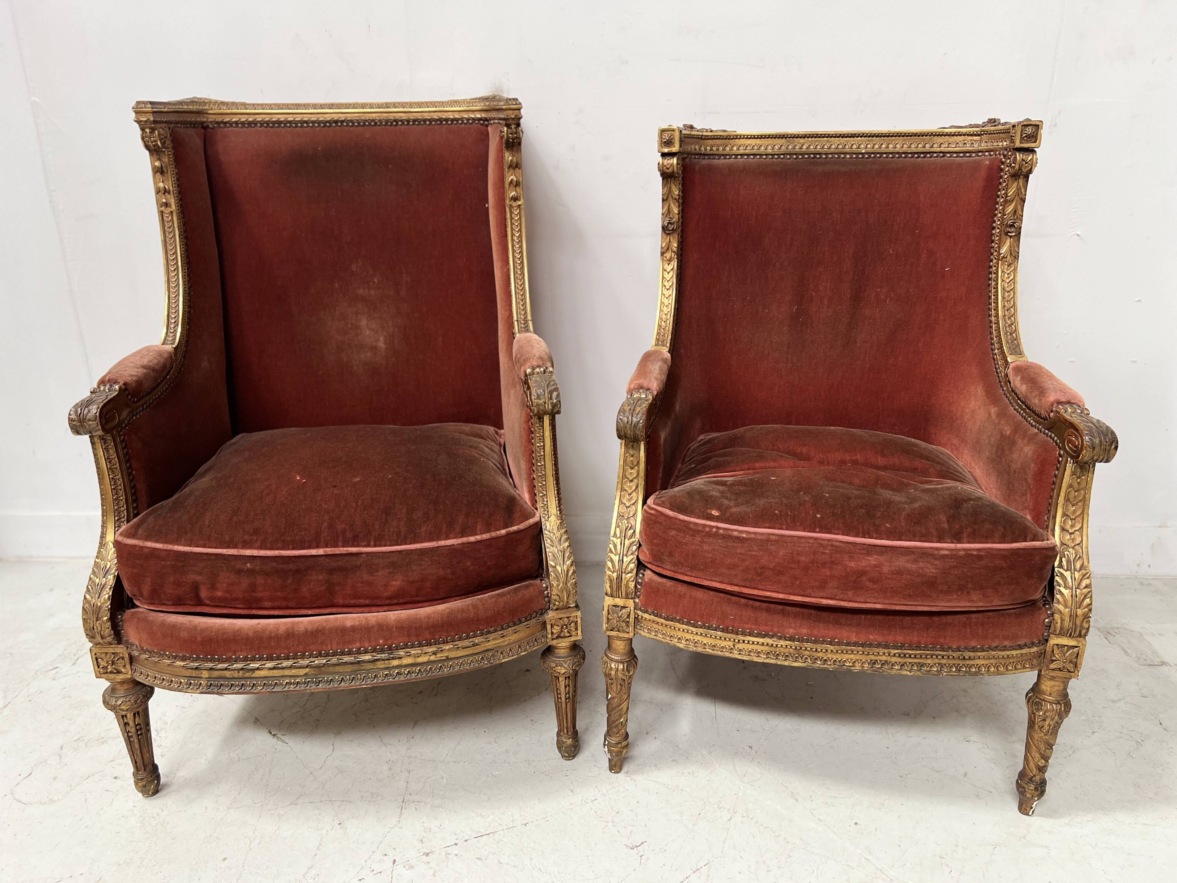 Two Louis XVI style wing chairs in gilded wood, 20th century