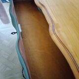 Dark green patina crossbow chest of drawers