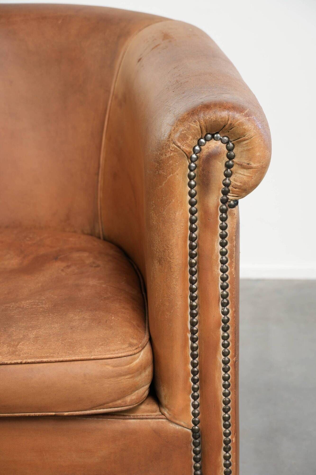 Vintage sheepskin club armchair in a beautiful light cognac colour