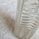 Antique cut crystal vase with a scalloped edge, decorated with palmettes.