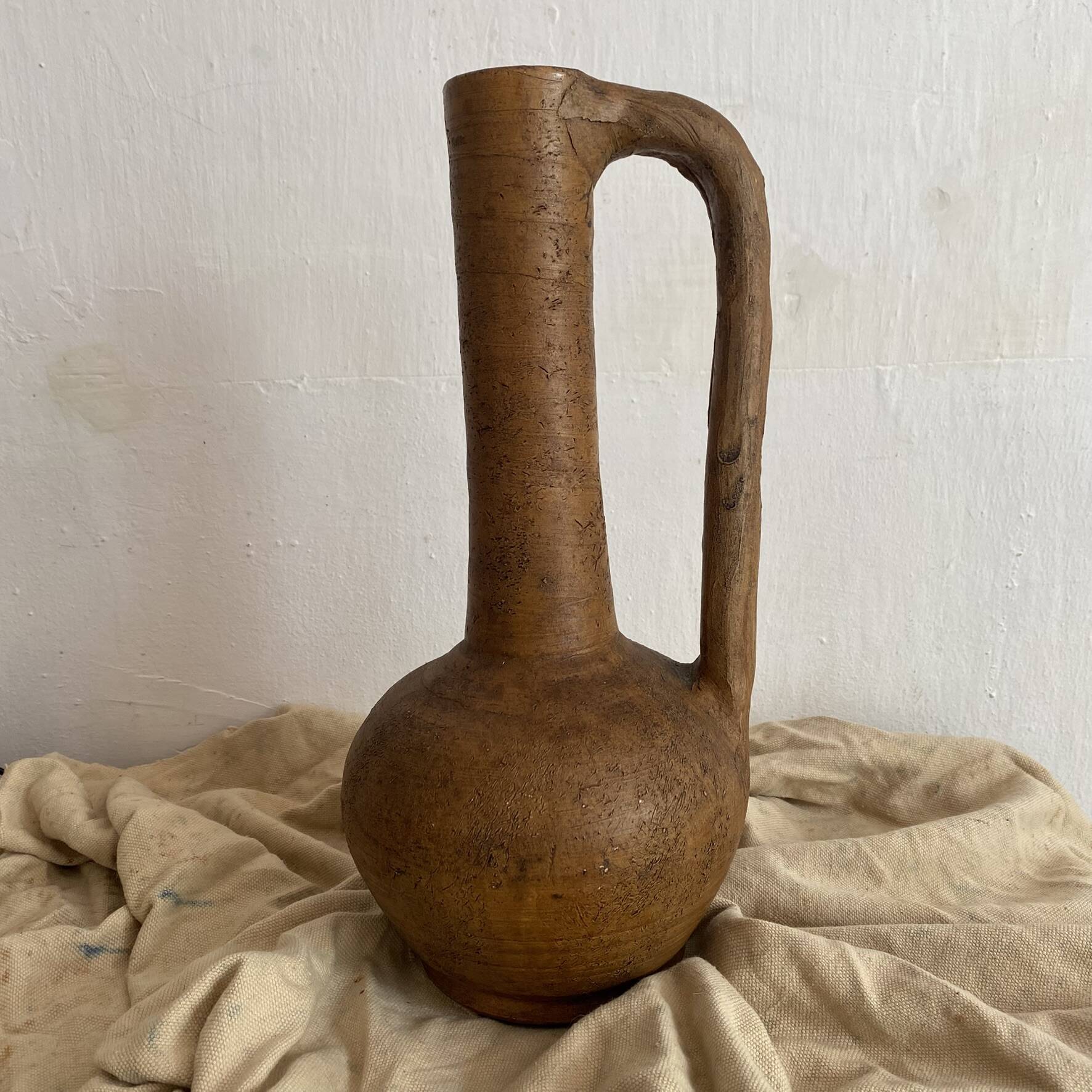 Large terracotta jug, vintage craftsmanship, wabi-sabi.