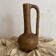 Large terracotta jug, vintage craftsmanship, wabi-sabi.