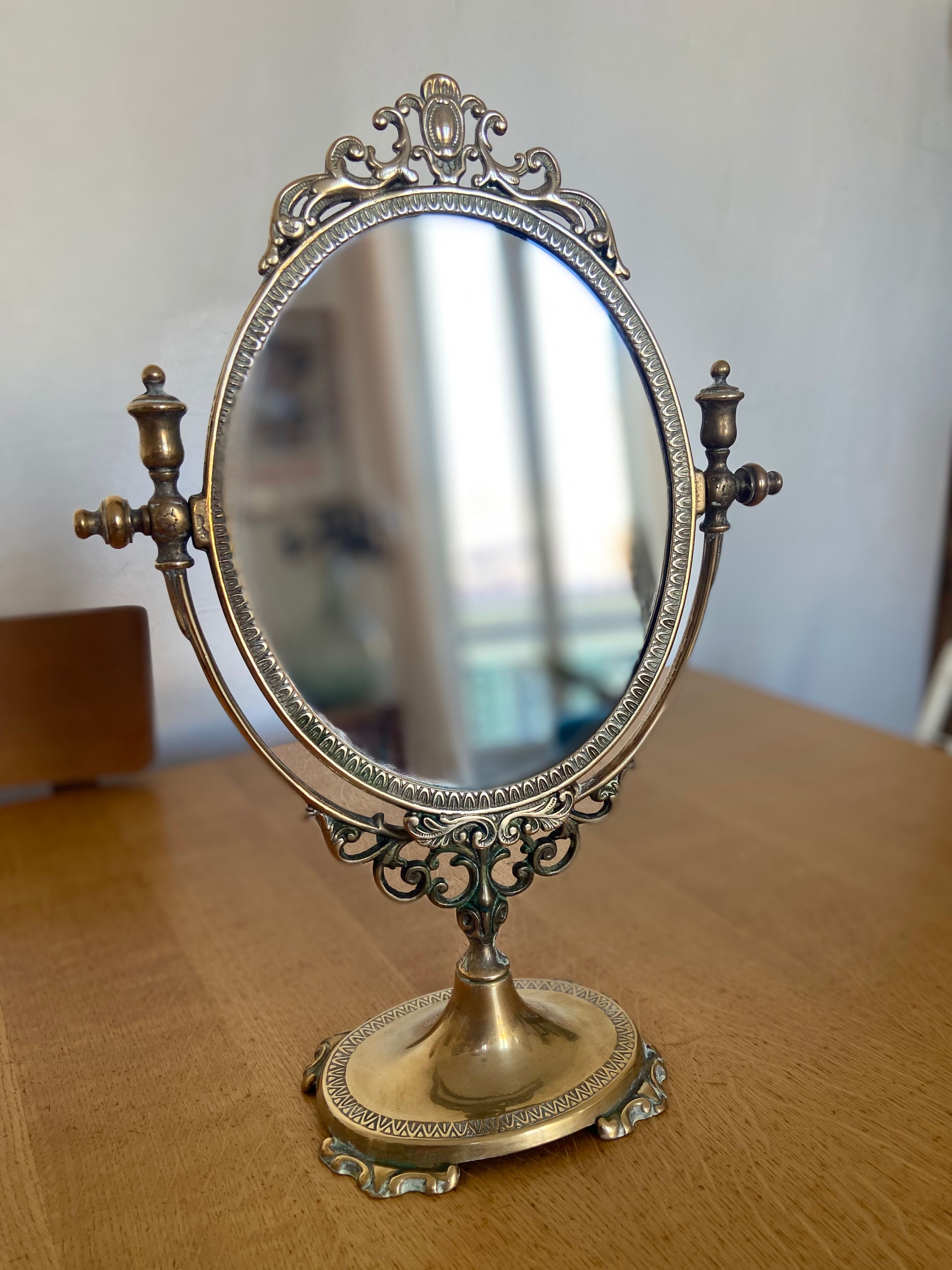 Psyche mirror, early XX th in golden brass