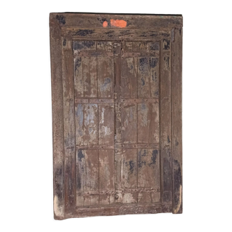 Old wooden door with frame