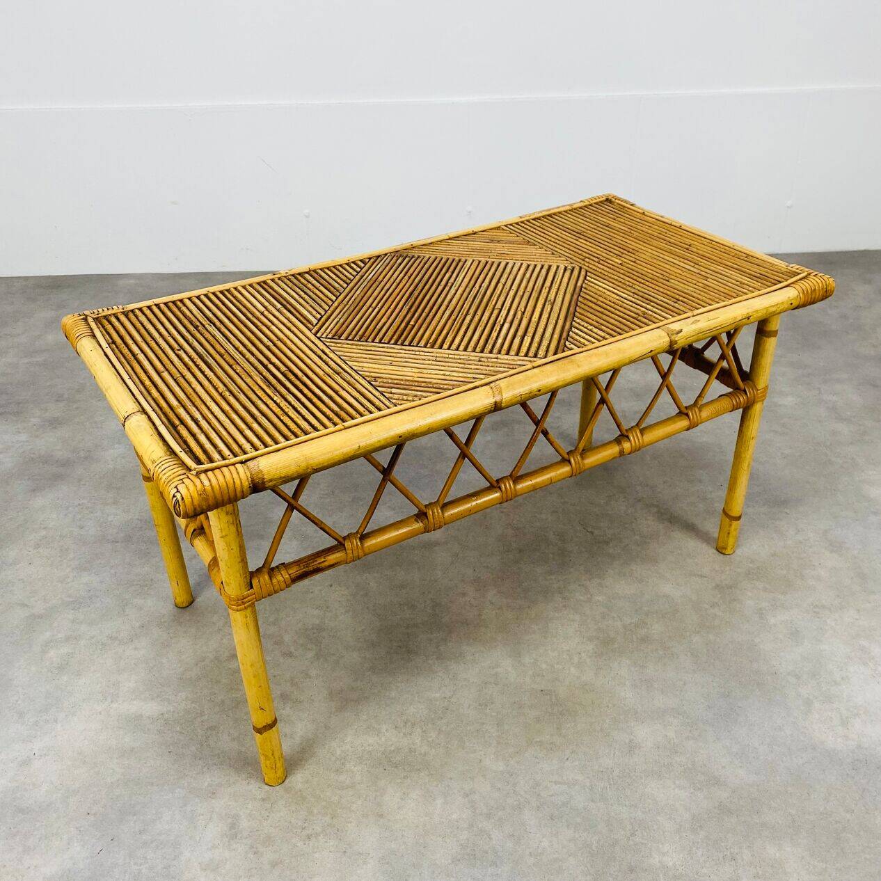 1960s rattan and bamboo coffee table, with its magazine rack.