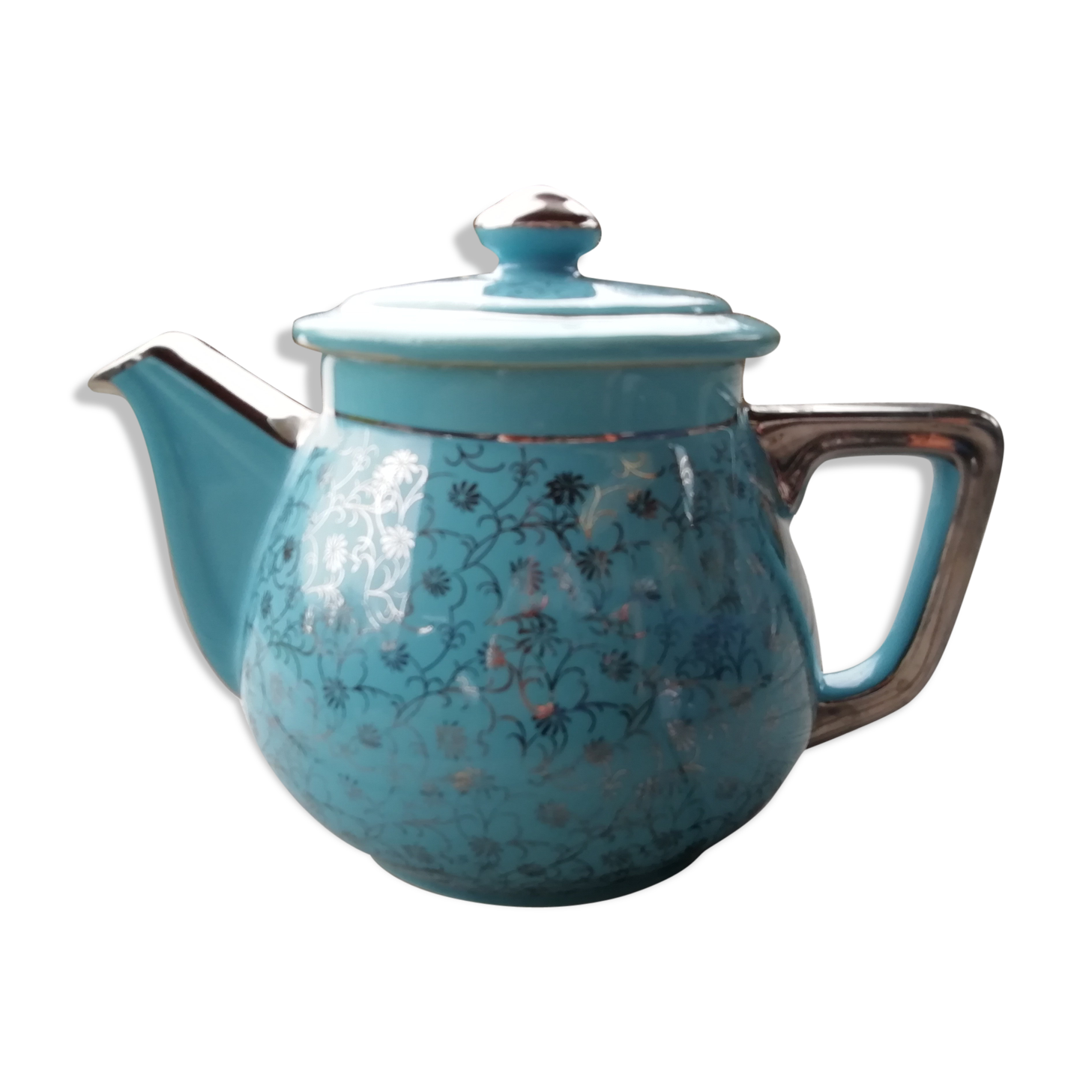 Semi blue teapot of silver flowers