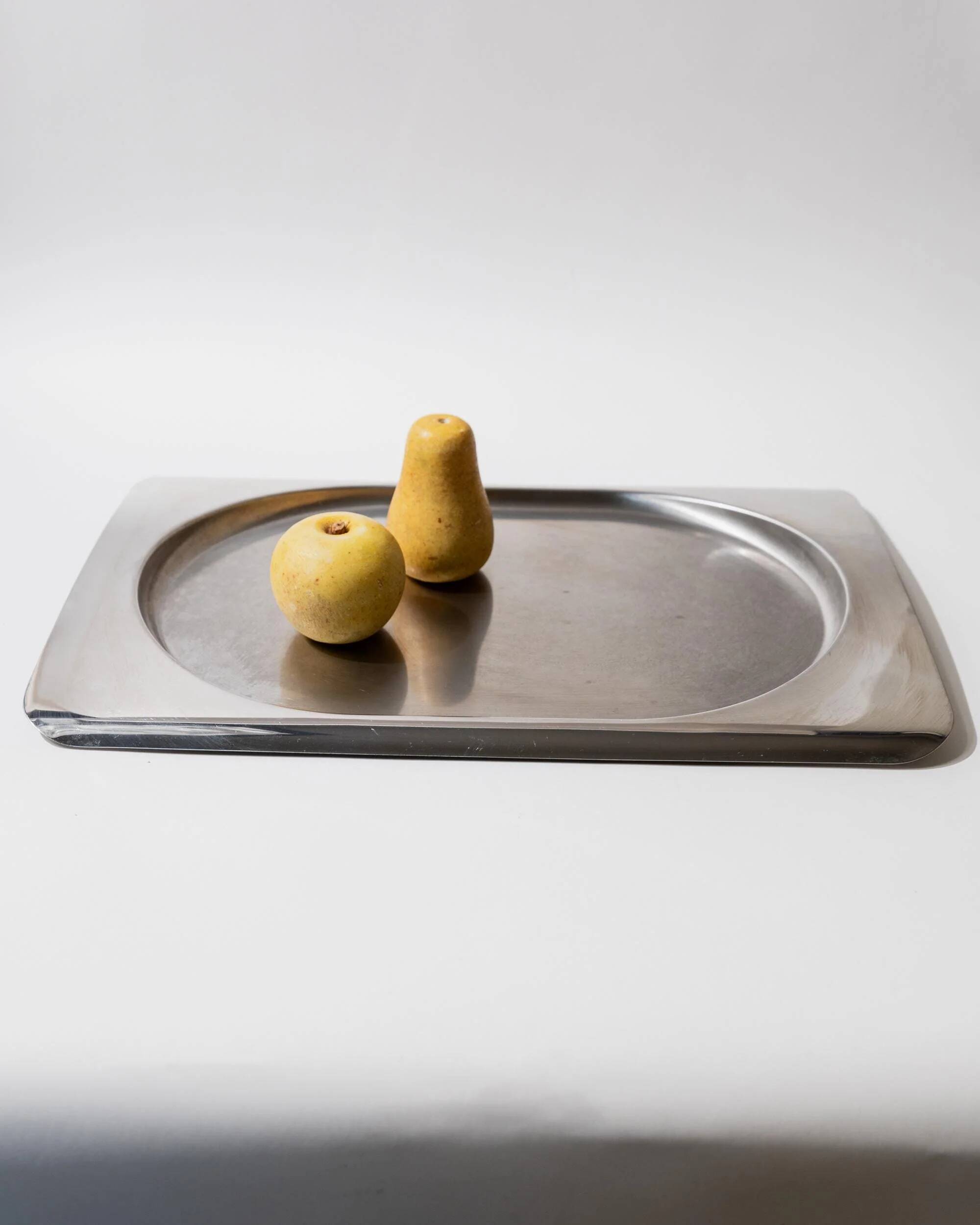 1990s vintage stainless steel platter, rectangular with an oval indentation, minimalist modern design.