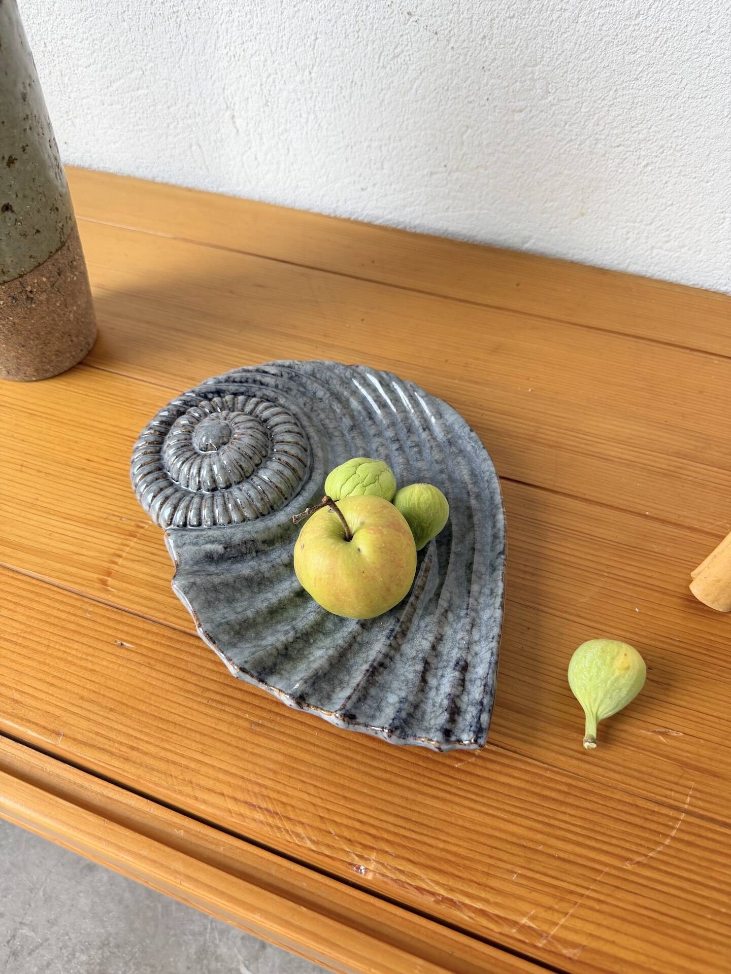 Shell-shaped ceramic catchall.