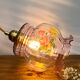 Vintage pink glass hand lamp with flower motifs