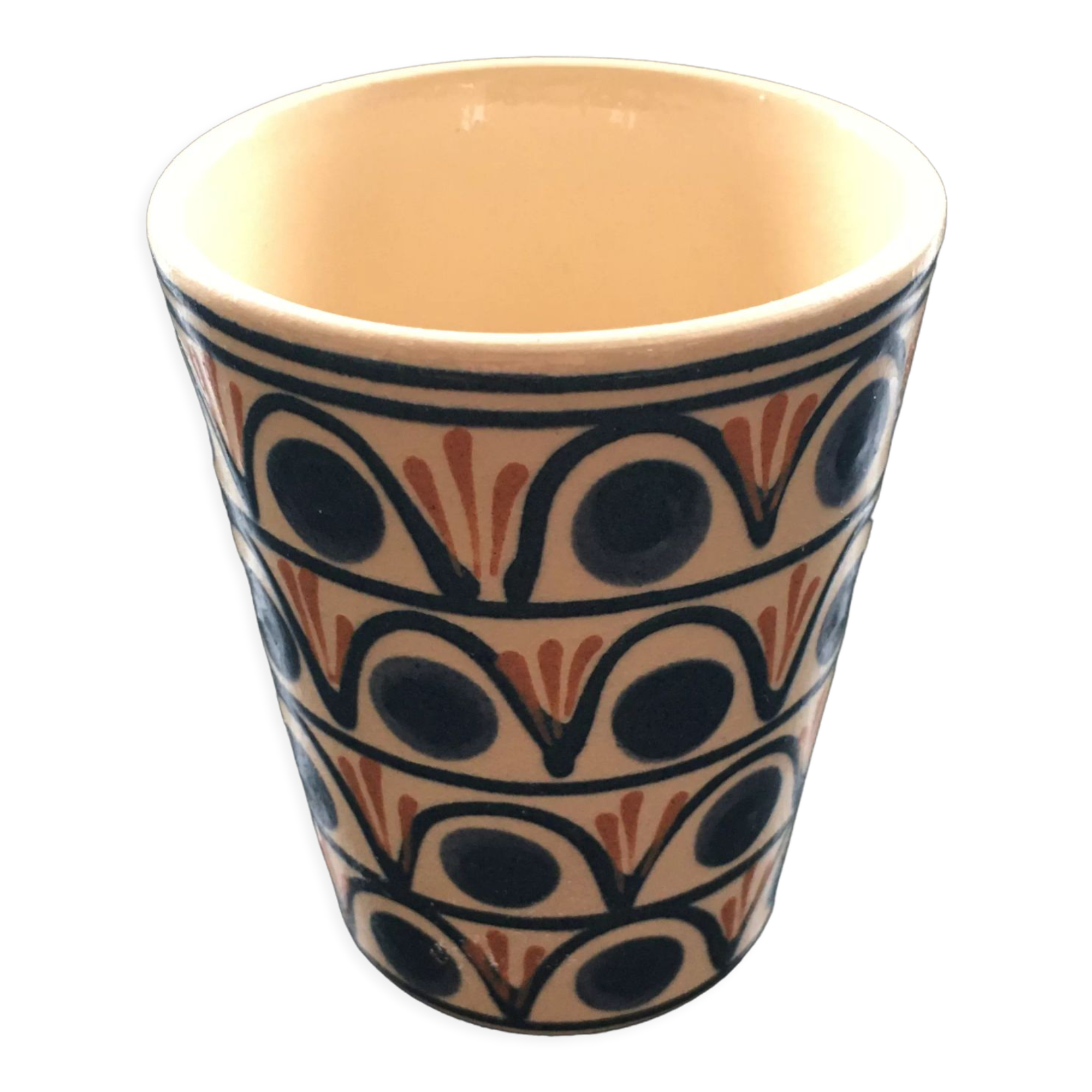Ceramic cup with a signed decoration