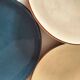 Set of 6 cream and grey-blue glazed earthenware plates.