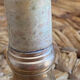 Pair of brass and stone candlesticks