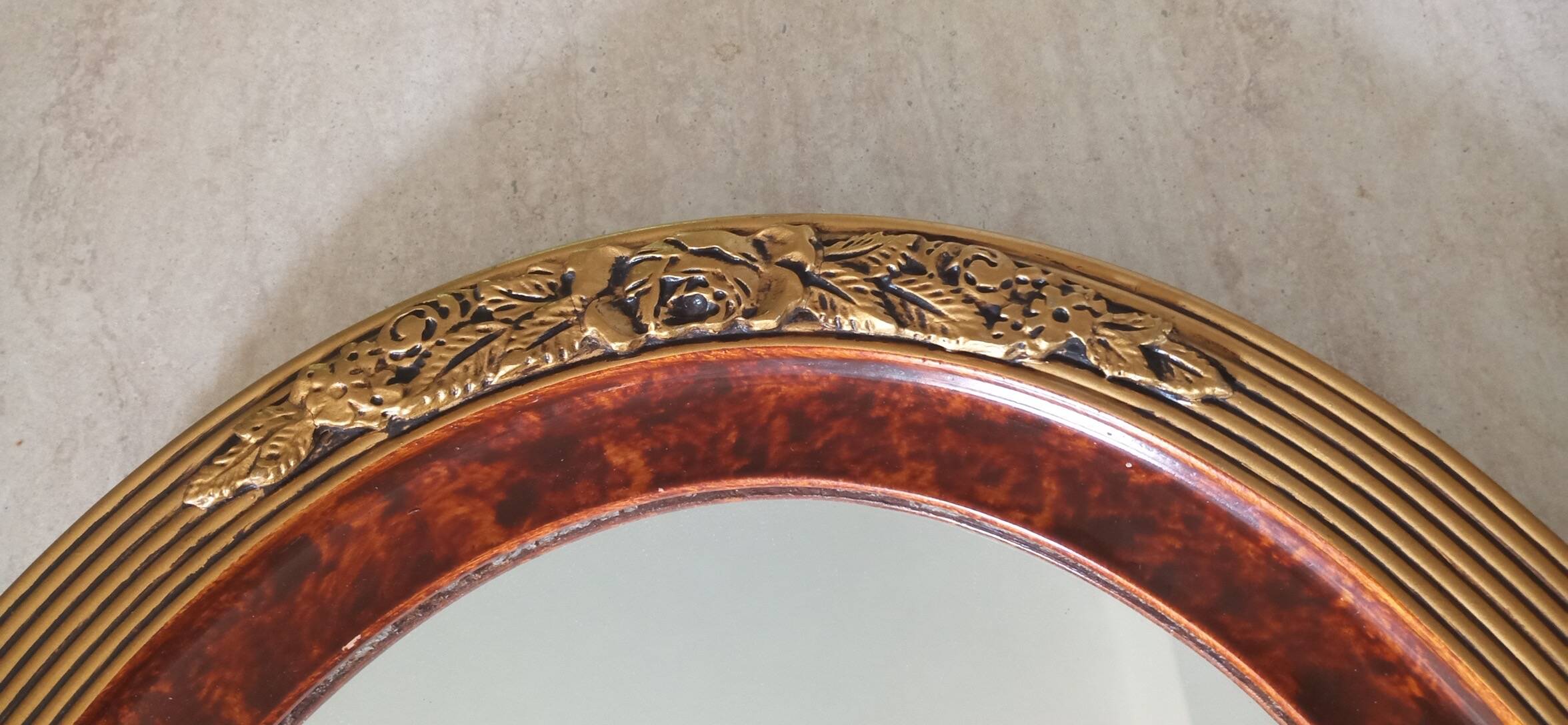 Modern oval mirror with flower decoration