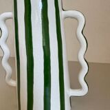 Green and white striped ceramic vase with abstract handmade corrugated handheld
