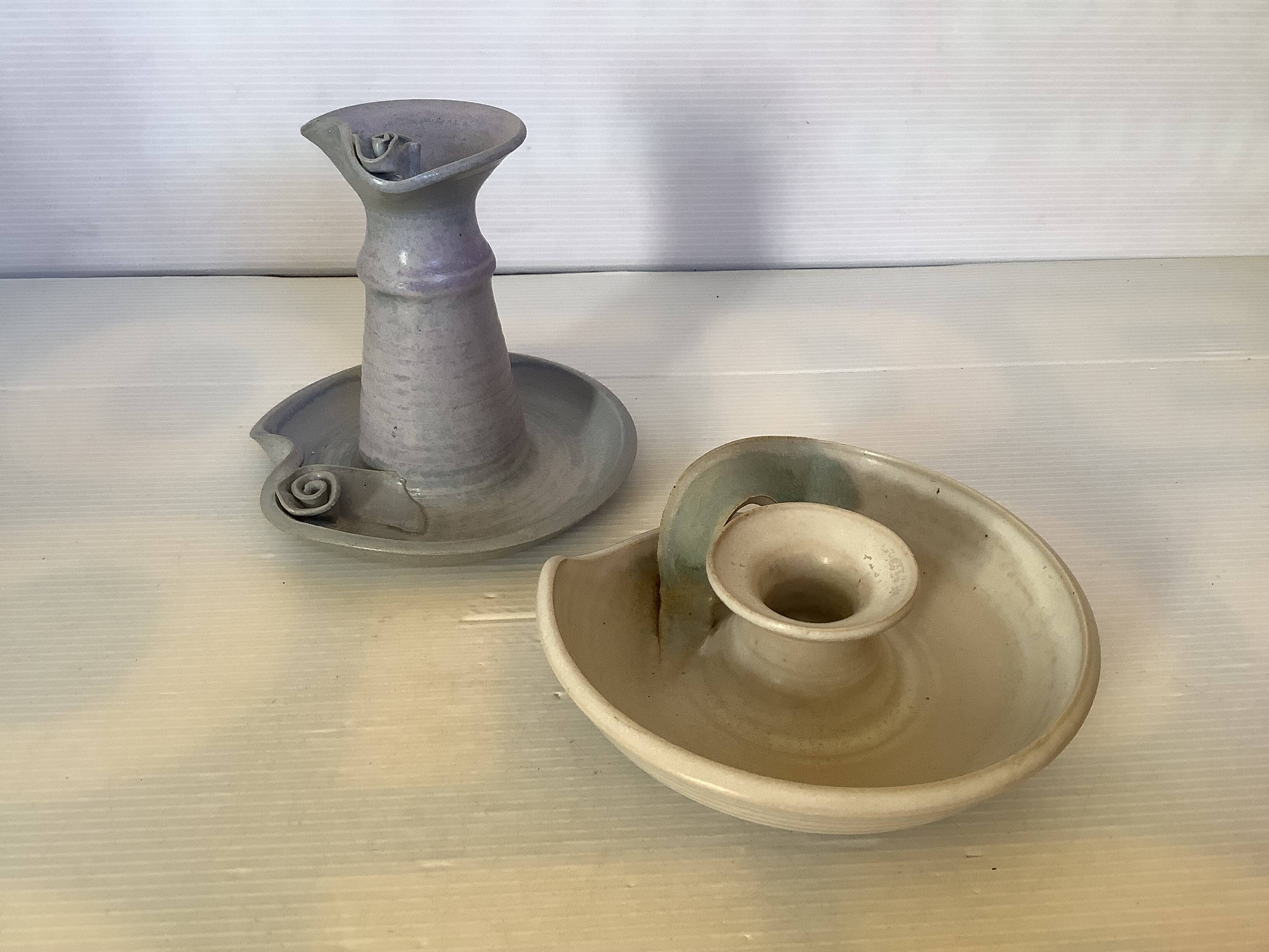 Pair of signed ceramic candlesticks