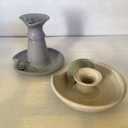 Pair of signed ceramic candlesticks