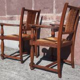 Pair of oak armchairs with straw seats and backs.