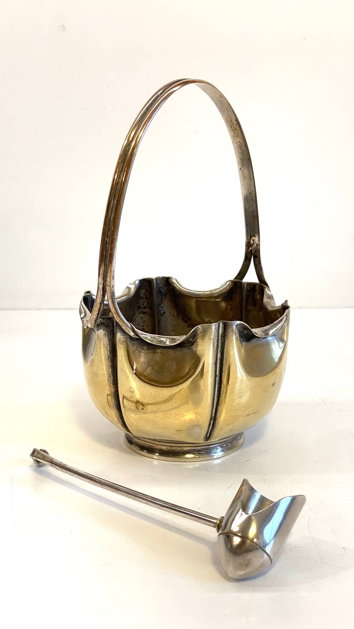 silver metal sugar bowl with gold patina