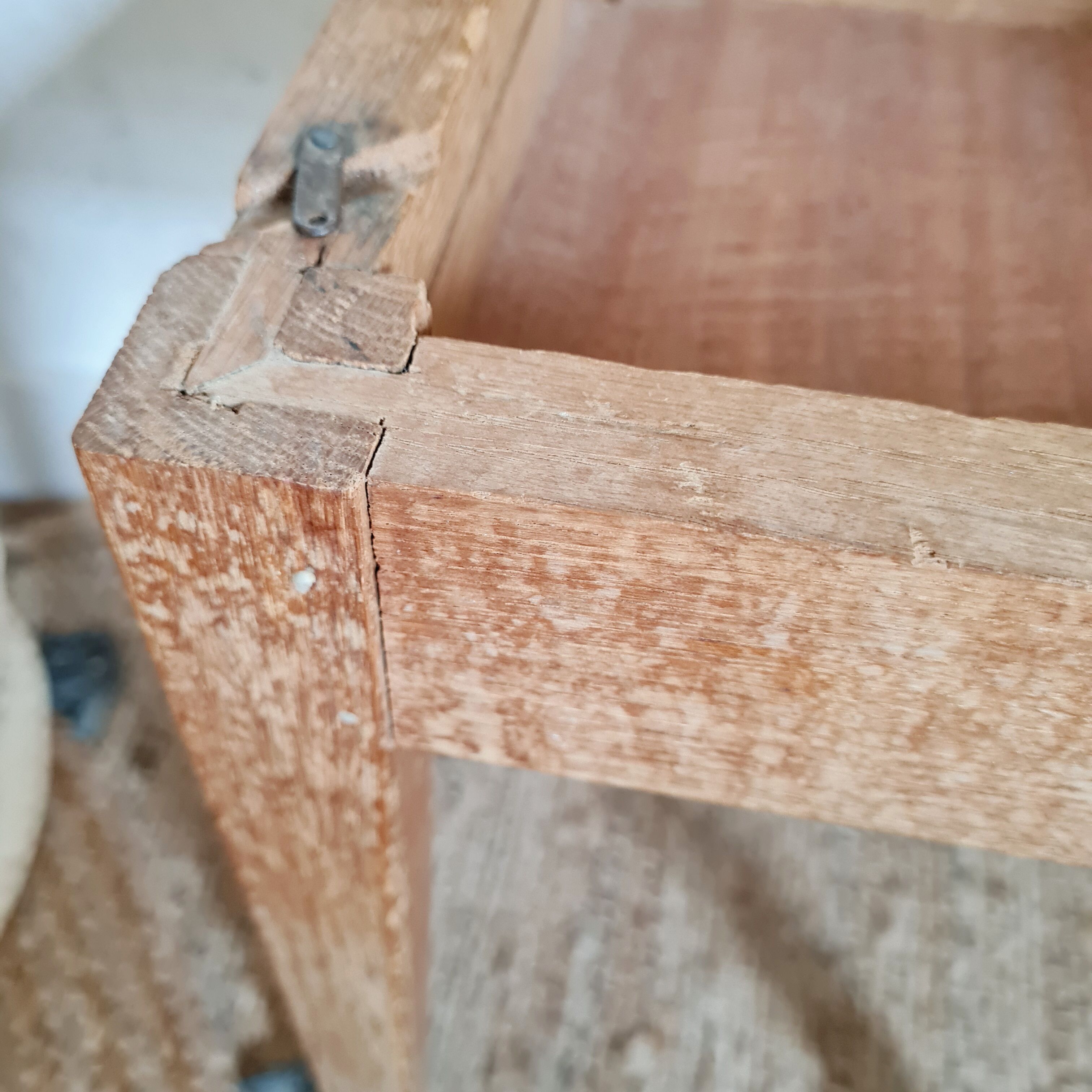 Wooden wax stool and orange formica