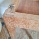 Wooden wax stool and orange formica