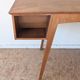 1950s oak double-sided desk with compass legs.