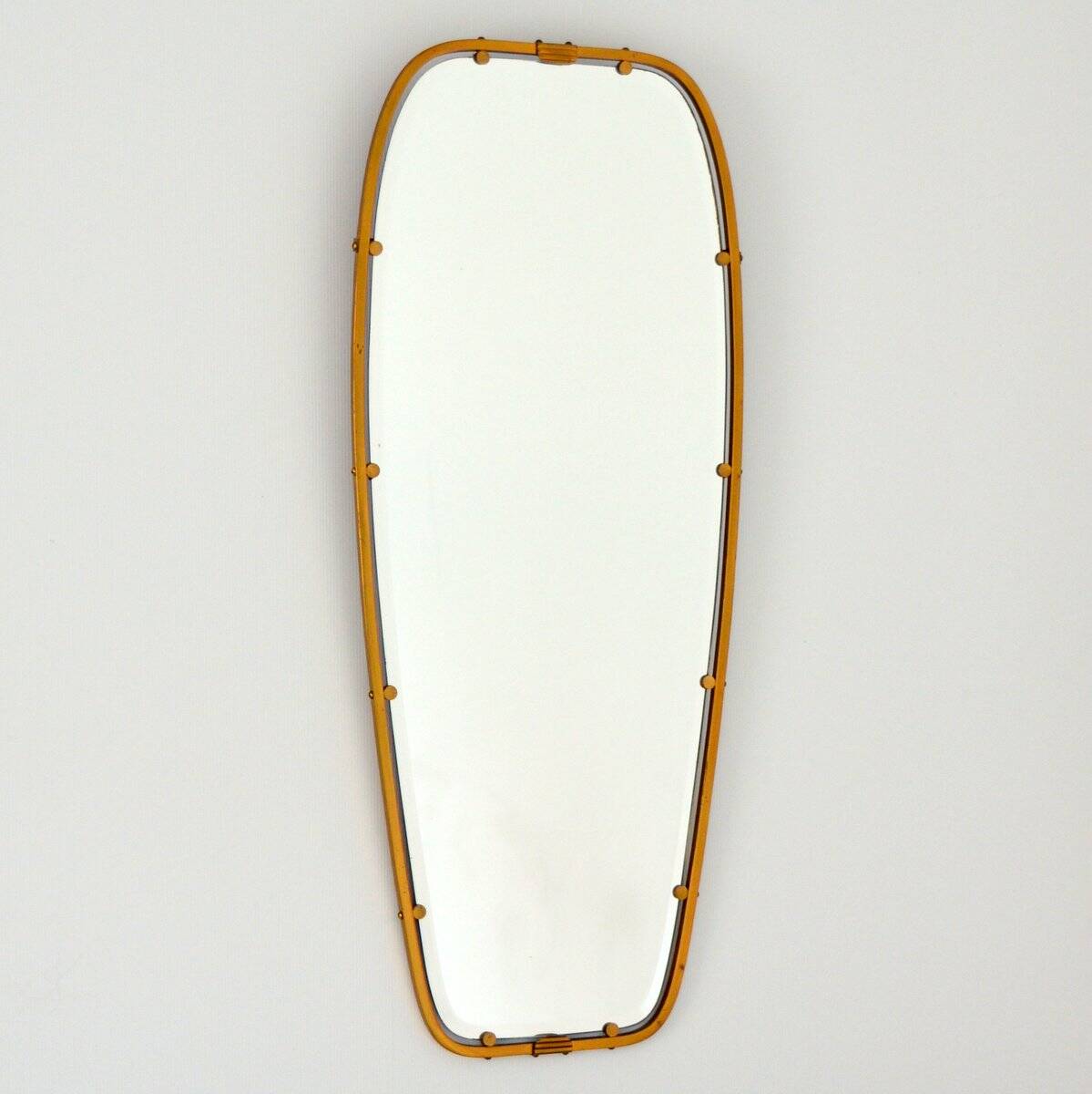 Superb free-form mirror in solid brass from the 50s/60s vintage.