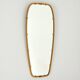 Superb free-form mirror in solid brass from the 50s/60s vintage.