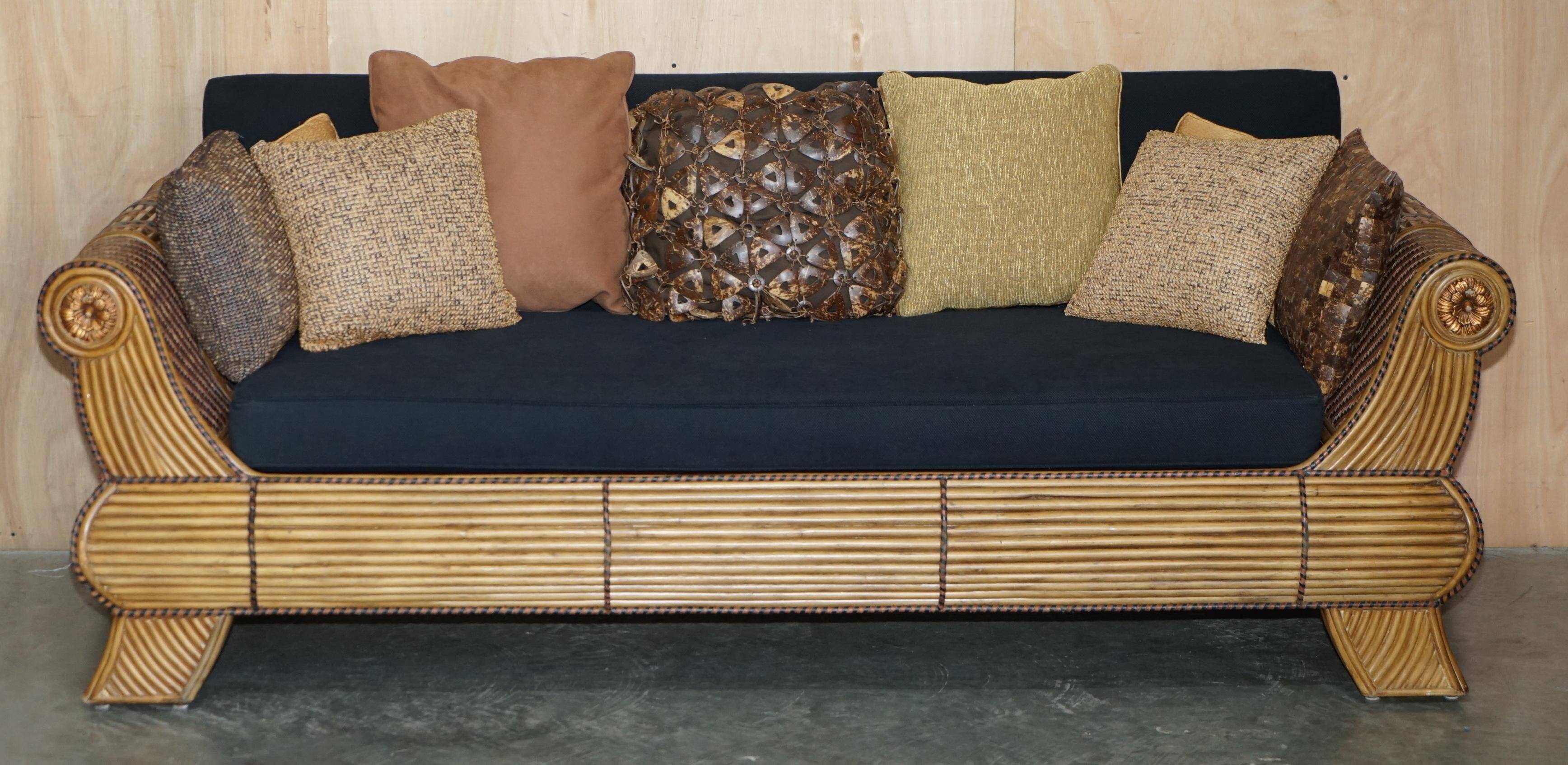 Vintage 1970s canapé with bamboo frame and Aztec patterns.