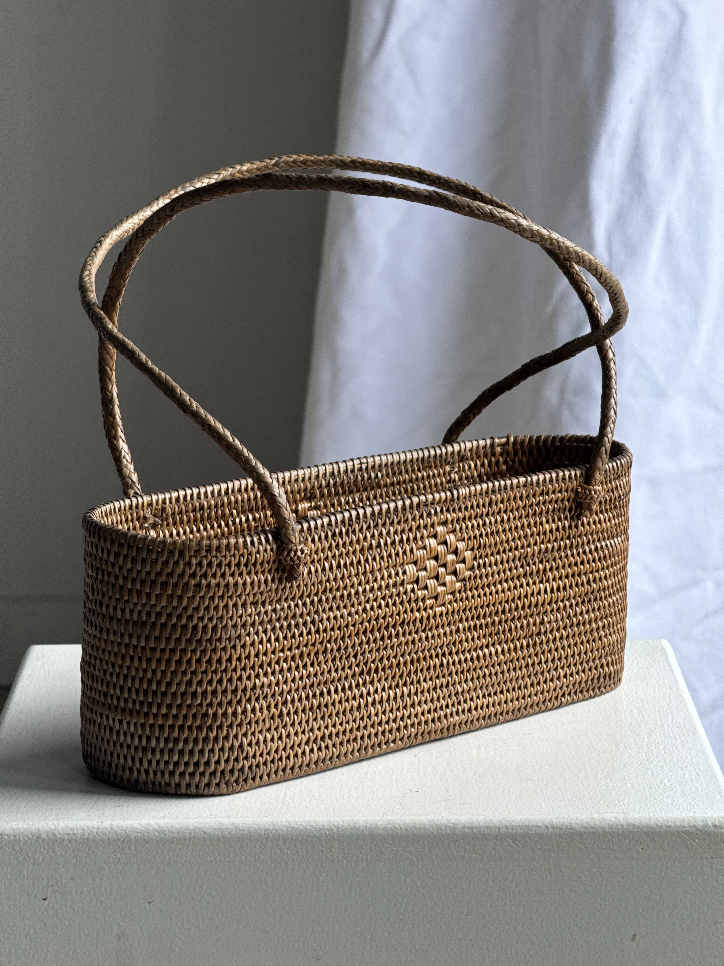 Small oval basket with long handles, traditional Indonesian L28xH10