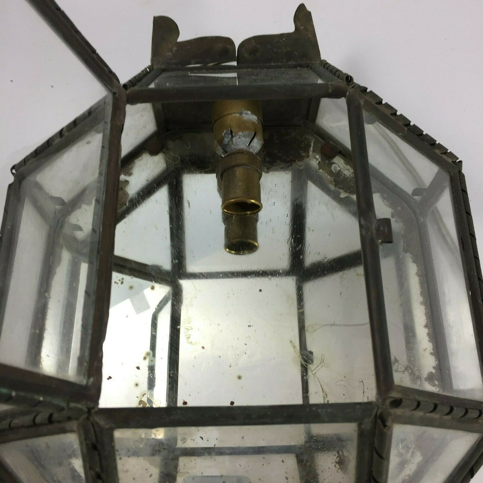 Metal and brass wall light with mirror background 1900