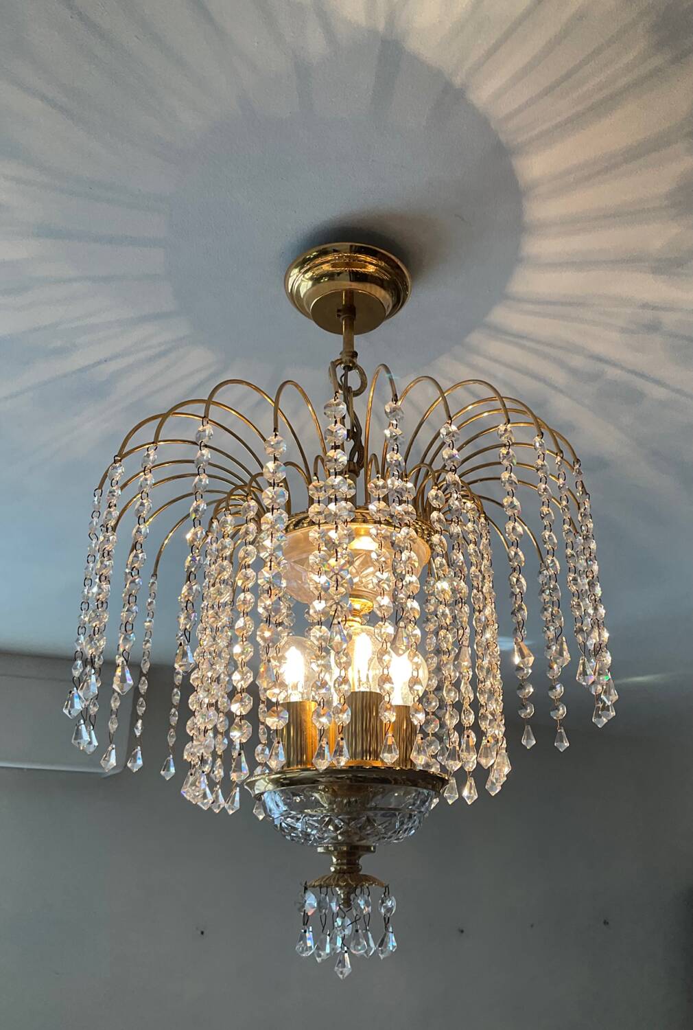 Brass waterfall chandelier with crystal tassels