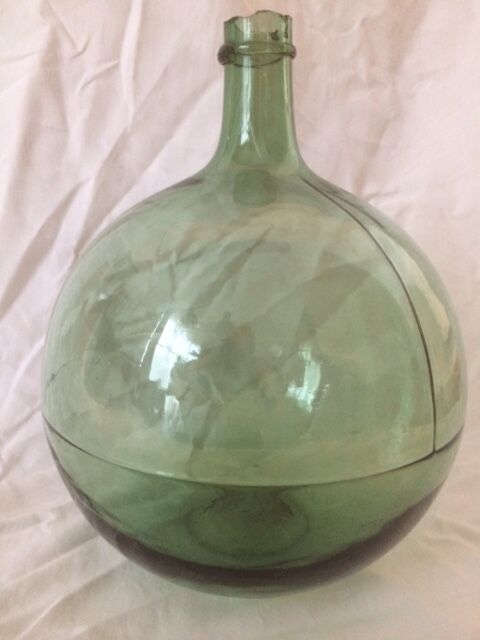 Demijohn old transparent green, estimated capacity around 12 to 15L