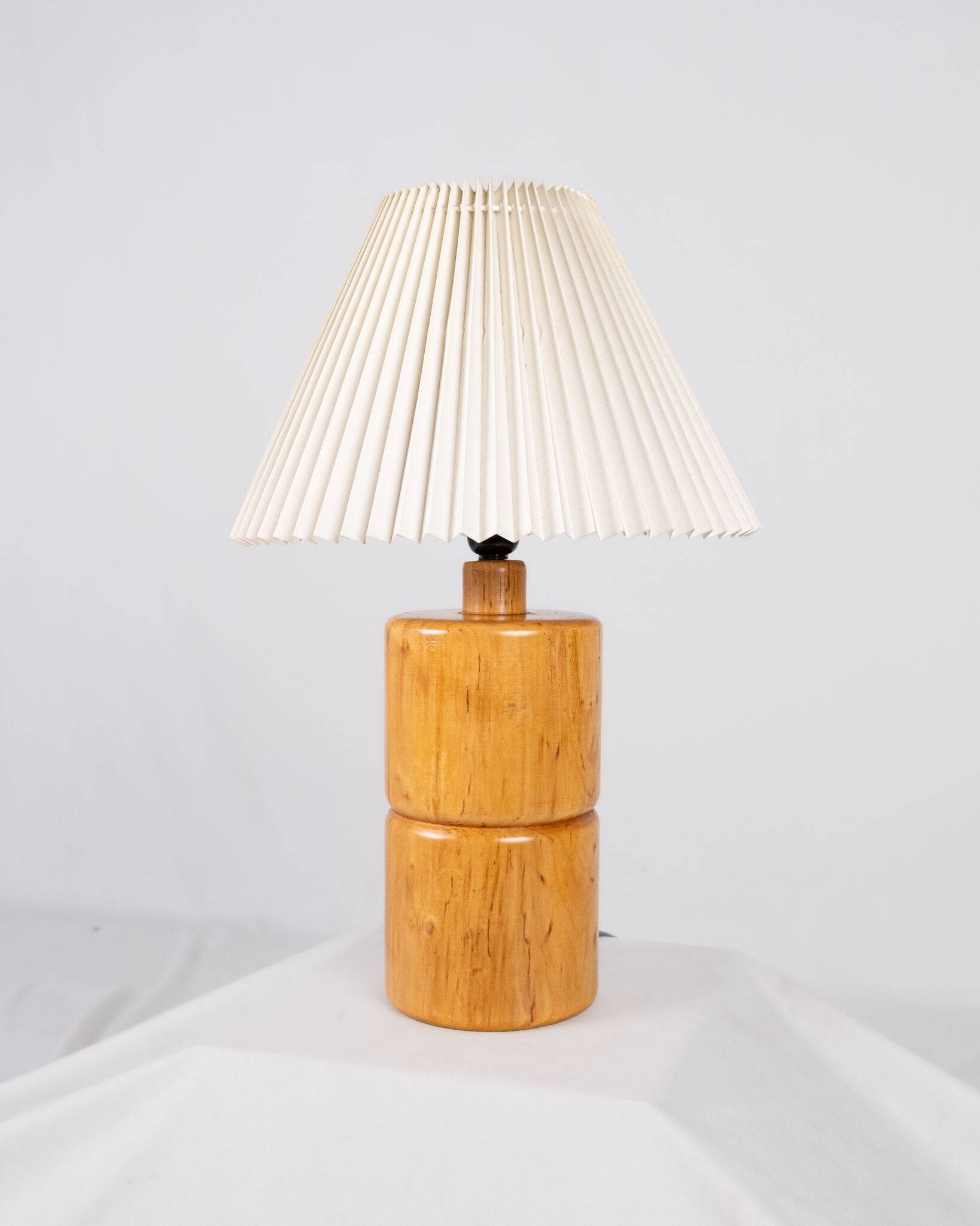Cylindrical table lamp made of solid turned wood, France, 1970.