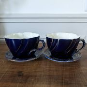 Set of two large Lunéville cups and saucers