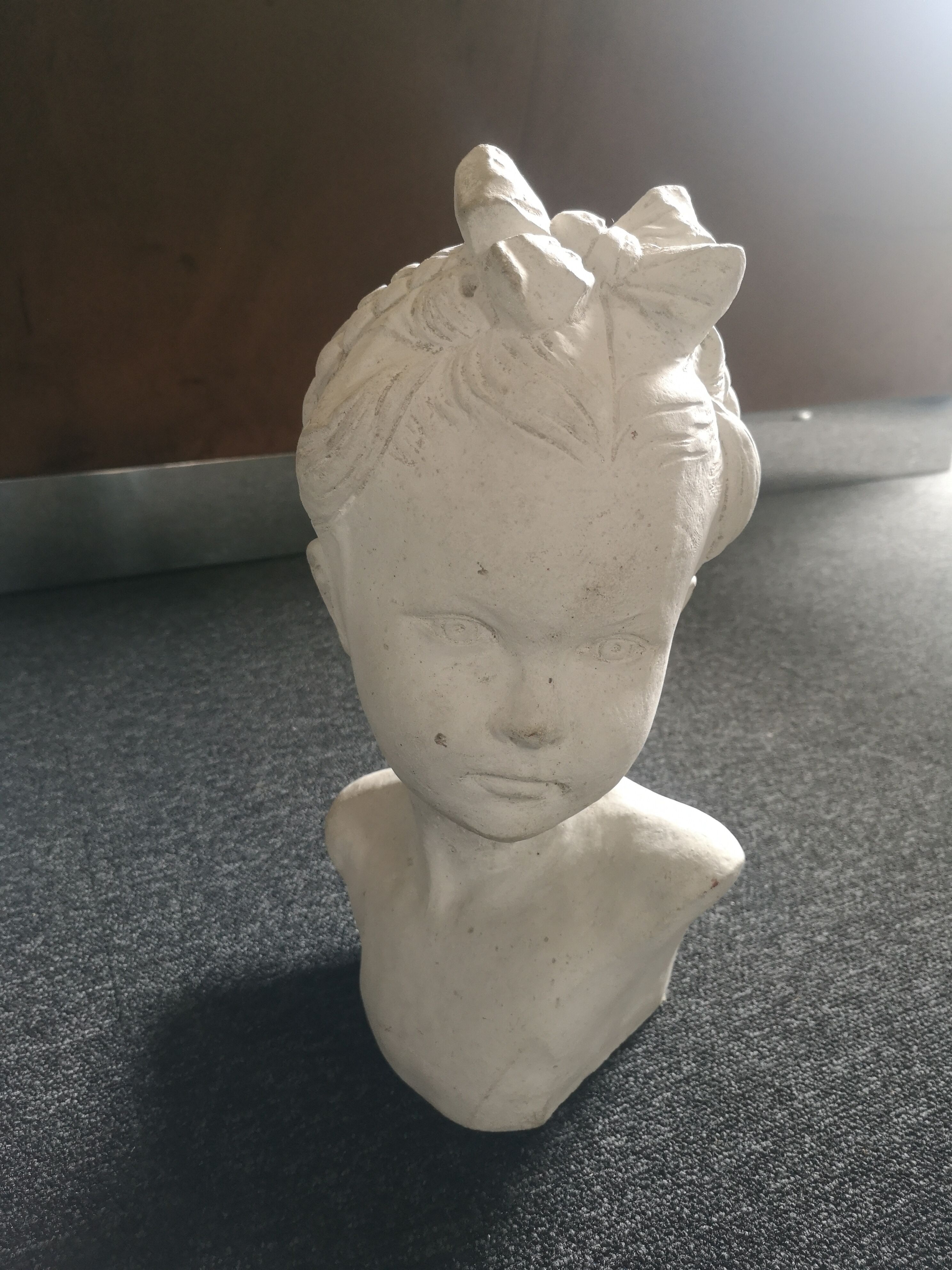 Bust girl in patinated terracotta