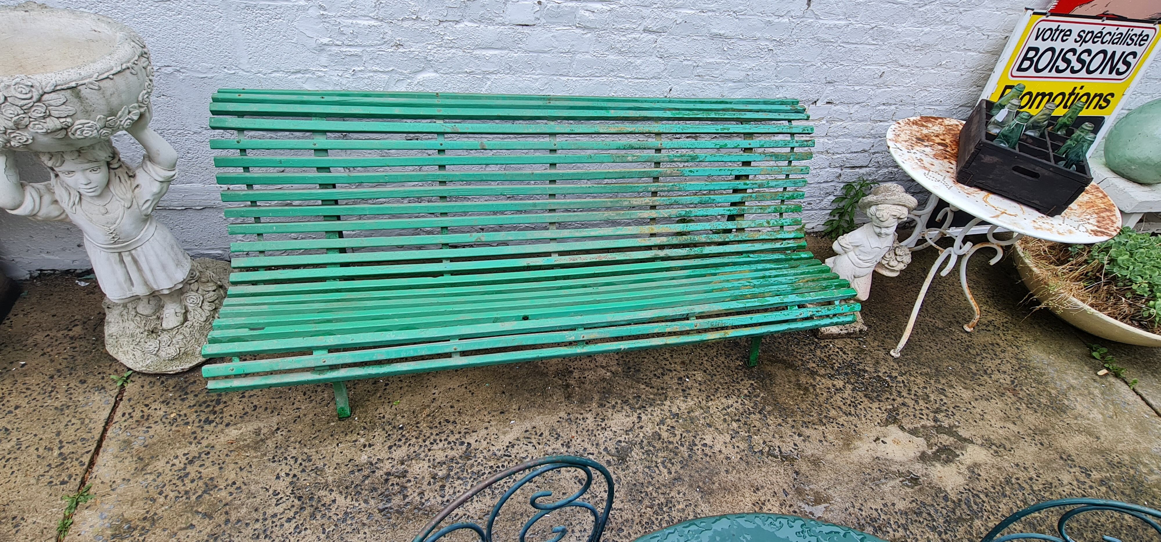 Old green garden bench Latte and wrought iron