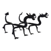 Pair of wrought iron fire dogs with dragons.