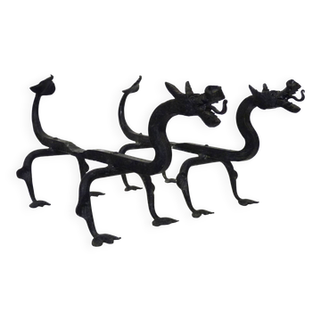 Pair of wrought iron fire dogs with dragons.
