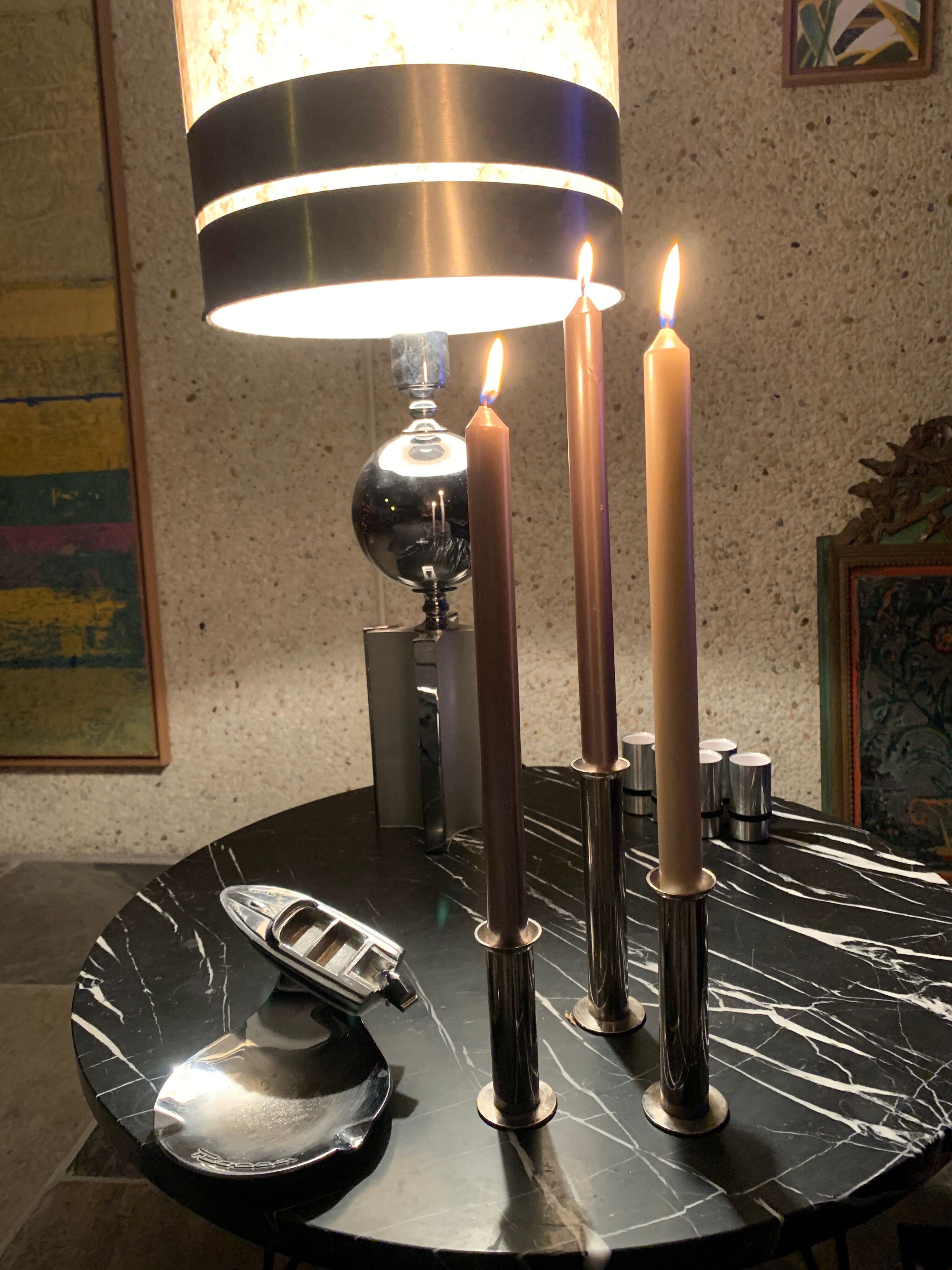 Three silver metal candle holders