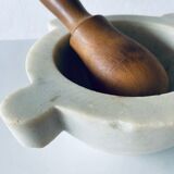Old marble mortar with wooden pestle