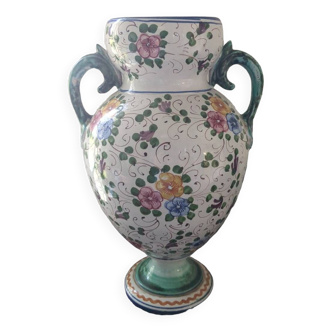 Old porcelain earthenware vase with floral decor