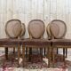 Set of 6 Louis XVI medallion chairs in wood and caning.