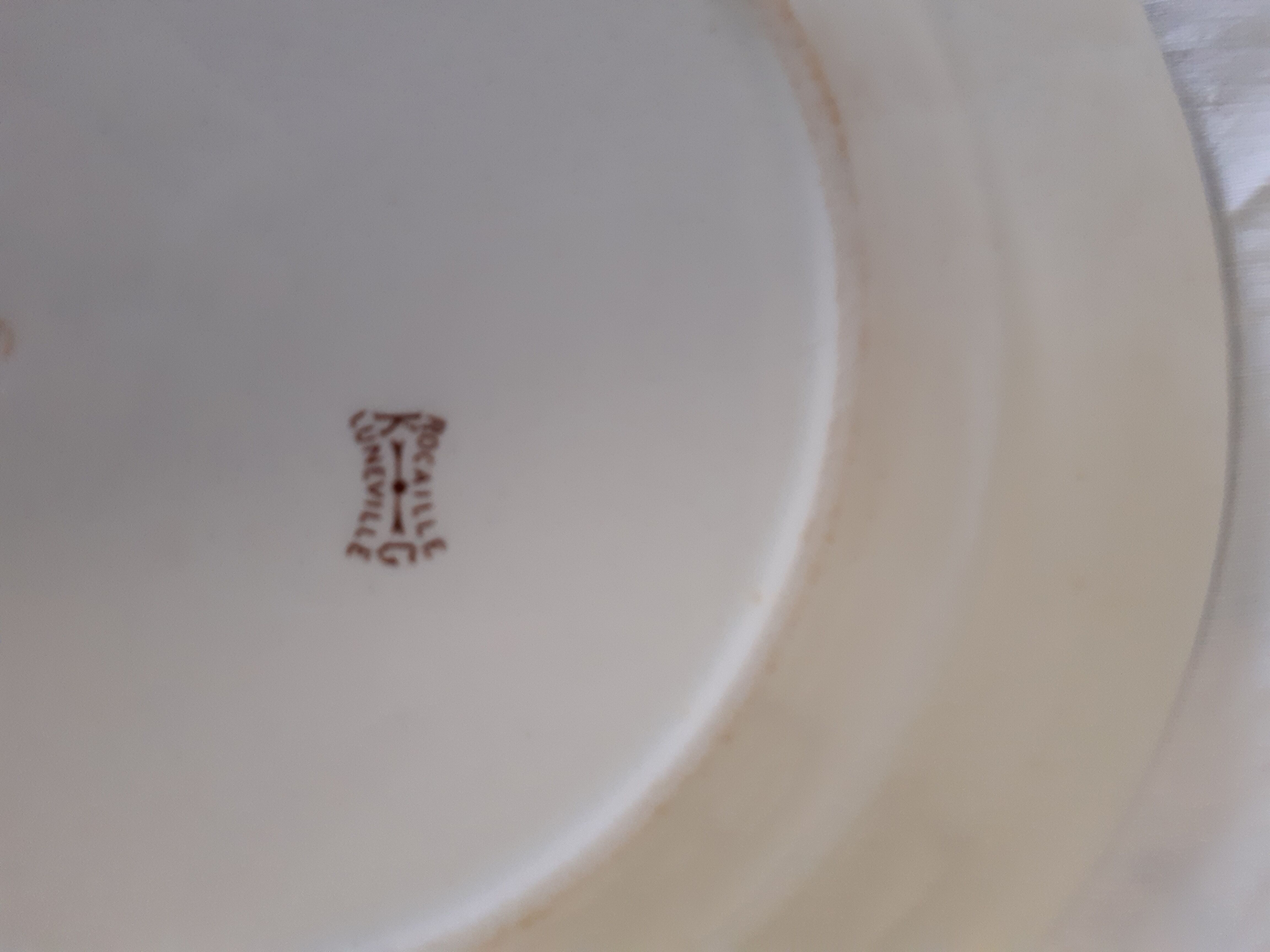 10 assiettes en faïence de Lunéville